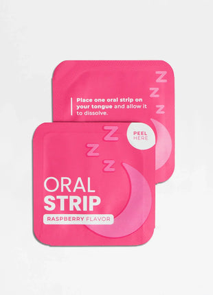 Two pink oral strip packages on a light gray background